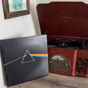 Pink Floyd Dark Side of the Moon vinyl record with stickers and posters